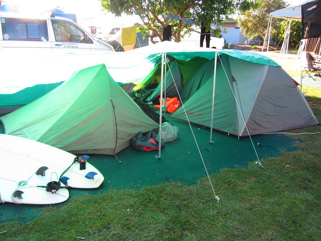 How do I set up a tent in wind?